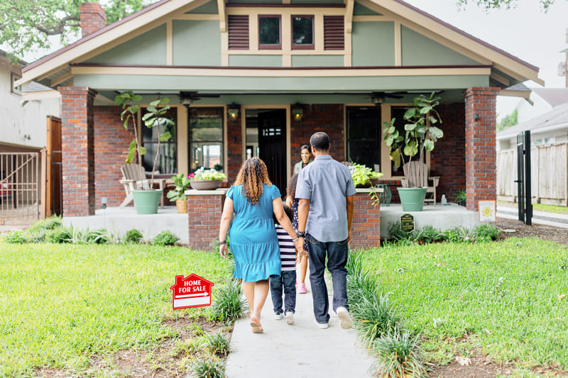 A couple tours a house.