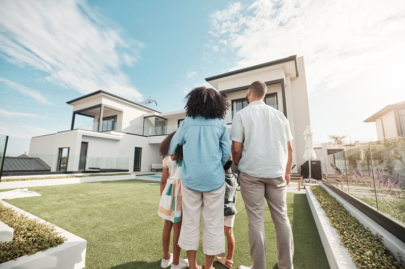A family tours a large modern home.