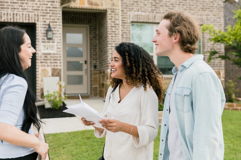 A couple smiles while buying a house with a jumbo loan in Alabama.
