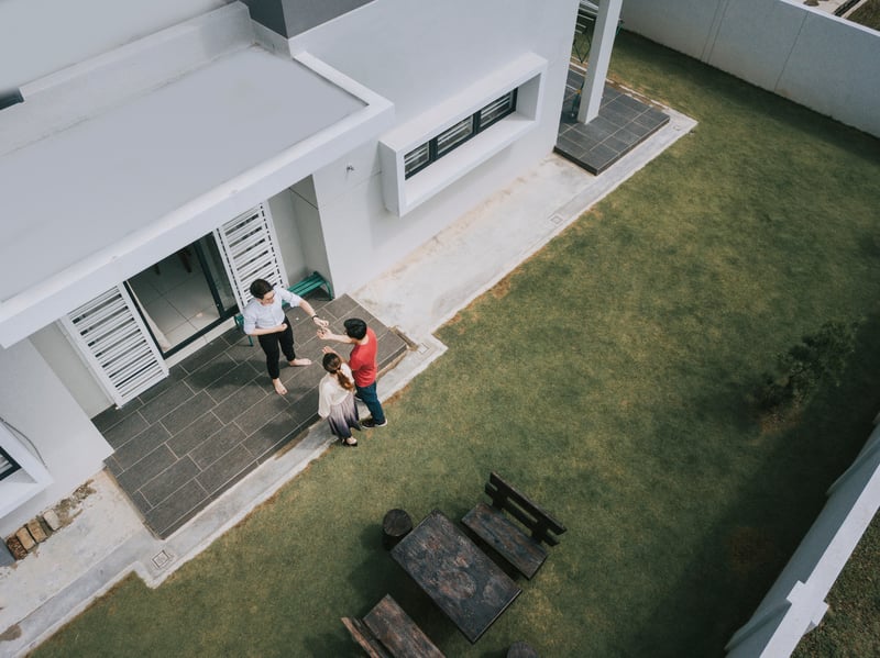 A man and woman move into a new house.