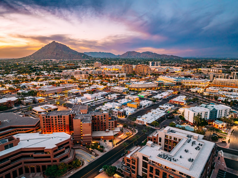 Downtown Scottsdale, Arizona with Camelback Mountain at sunset