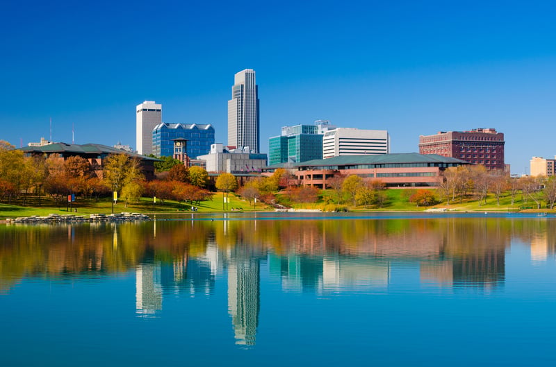 Downtown Omaha, Nebraska skyline and lake in autumn