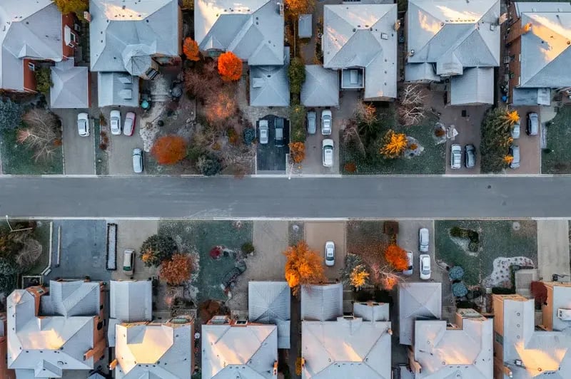 A neighborhood of multifamily homes seen from above.