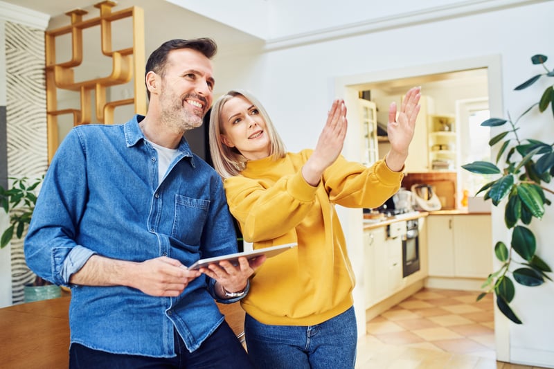 People smiling while planning home renovations