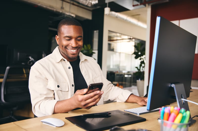 A real estate investor looks at DSCR options for short-term rentals on his phone.