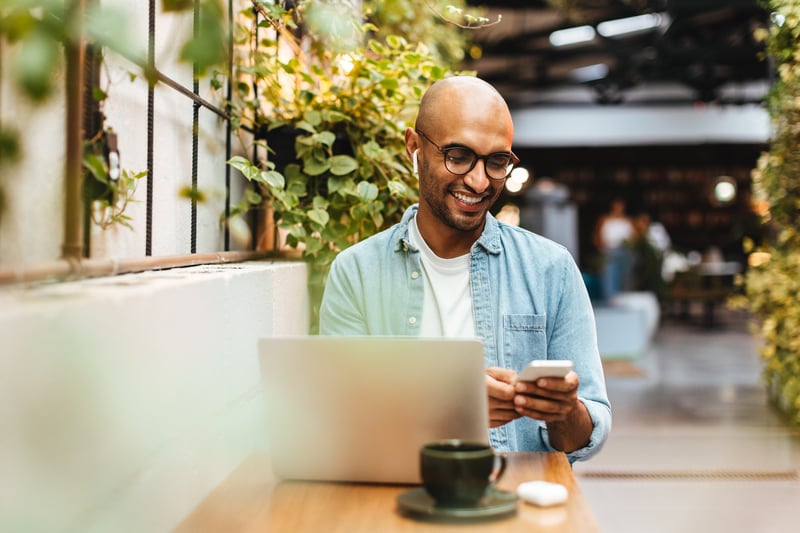 A man smiles while refinancing his VA loan with an IRRRL.