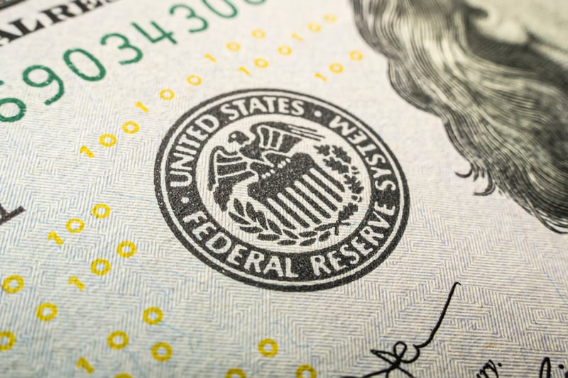 A federal reserve logo seen on a dollar bill.