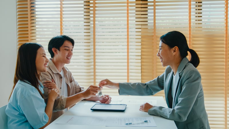 People smile while closing on a HELOC.