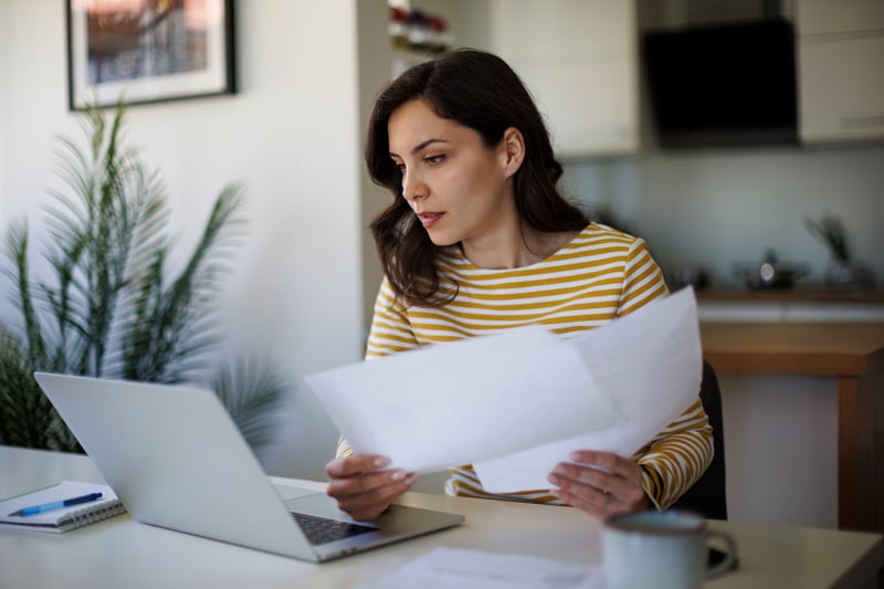 A woman calculates how much home she can afford.