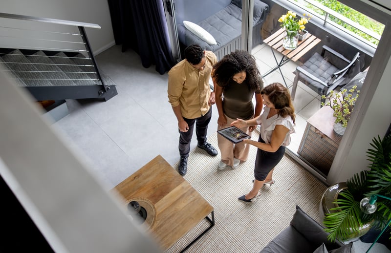 People tour an investment property.