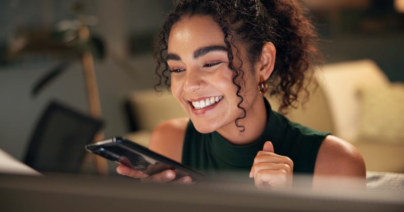 A real estate investor smiles while learning about getting a HELOC on an investmen