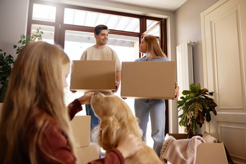 A family and their dog move into a new house.