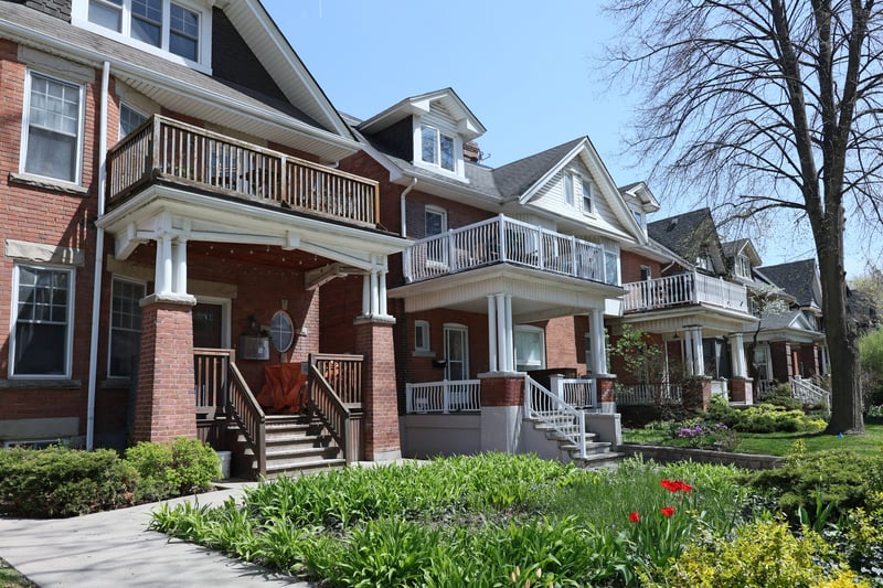 Multifamily properties on a suburban street.
