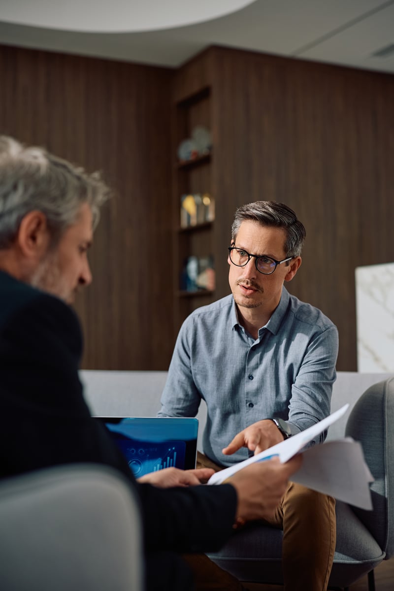 A man speaks with a loan officer.