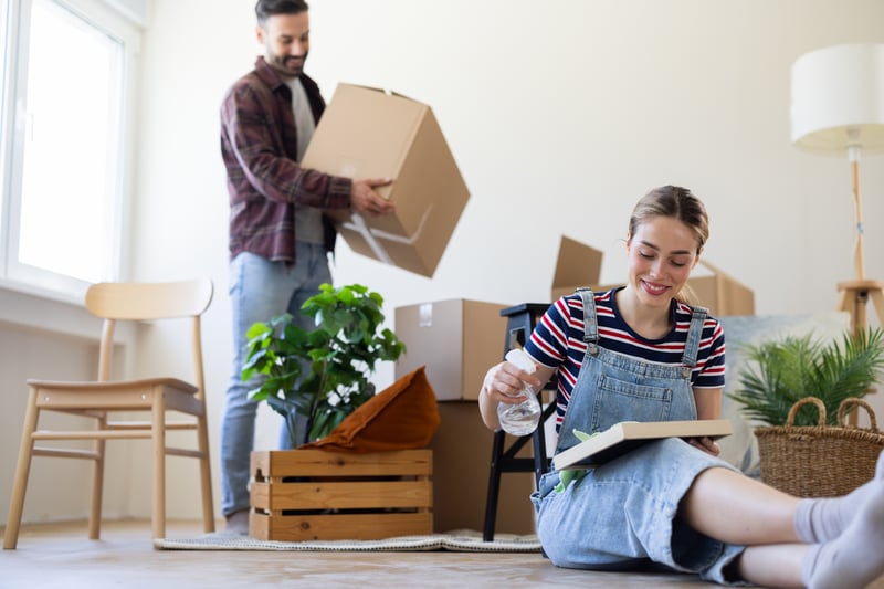 A man and a woman move into a new house.