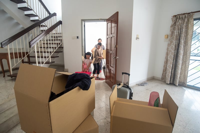A family walks into their new home.