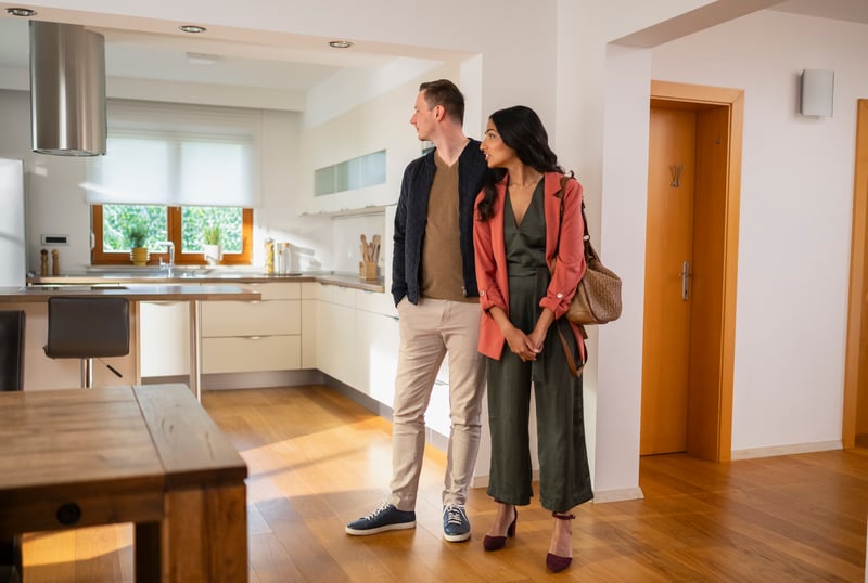 People stand in a new house.