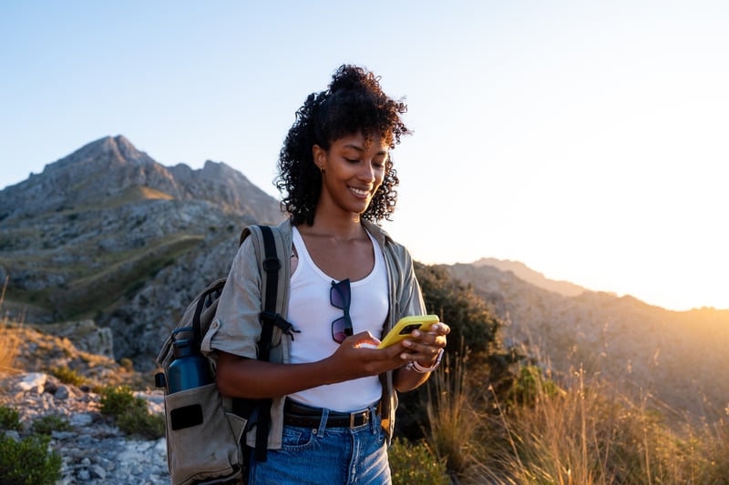 A woman smiles while looking at home equity loan options.