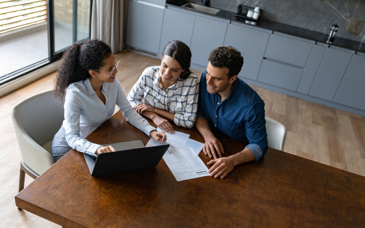 People evaluate mortgage options with a loan officer.