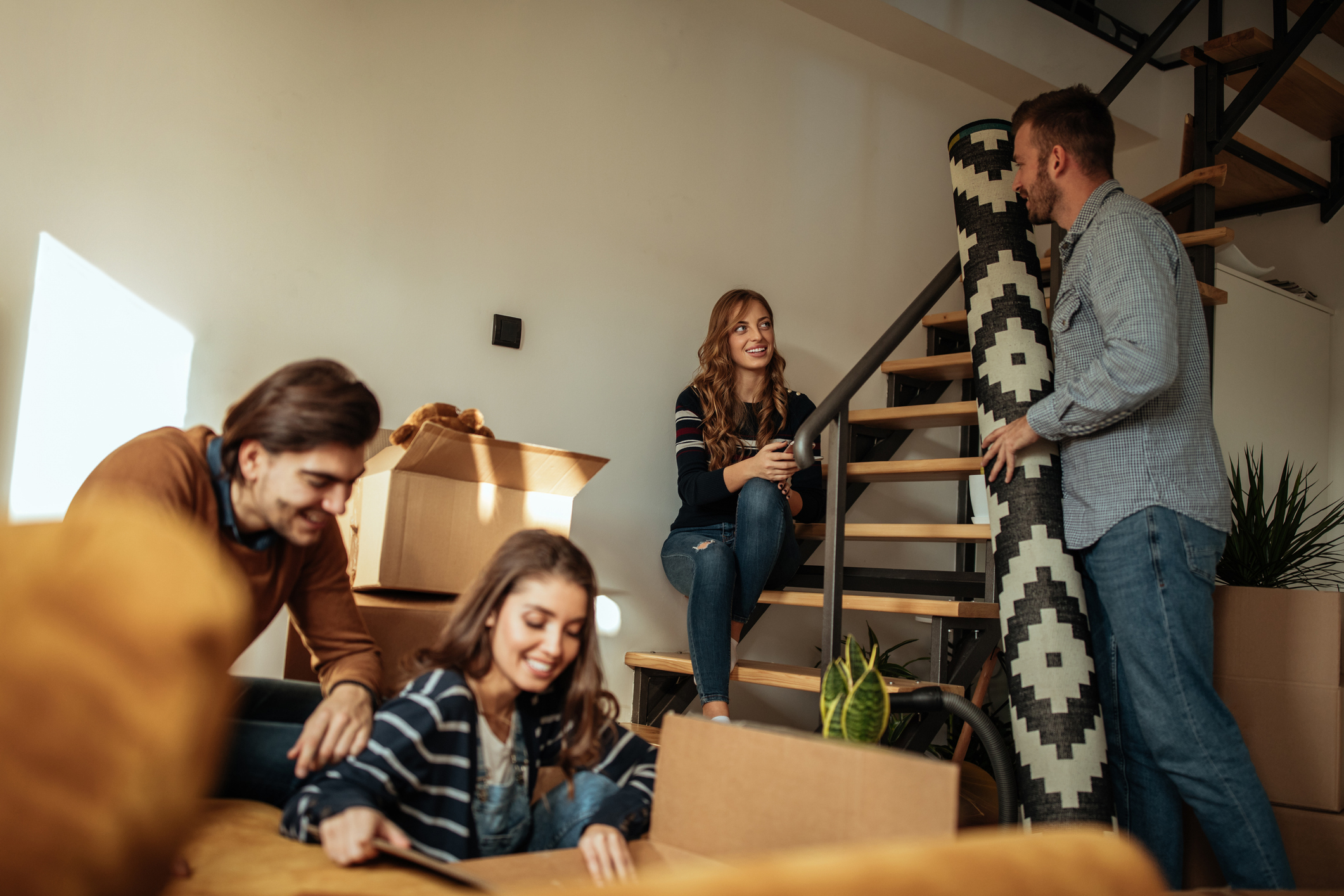A group of people help move into a house.