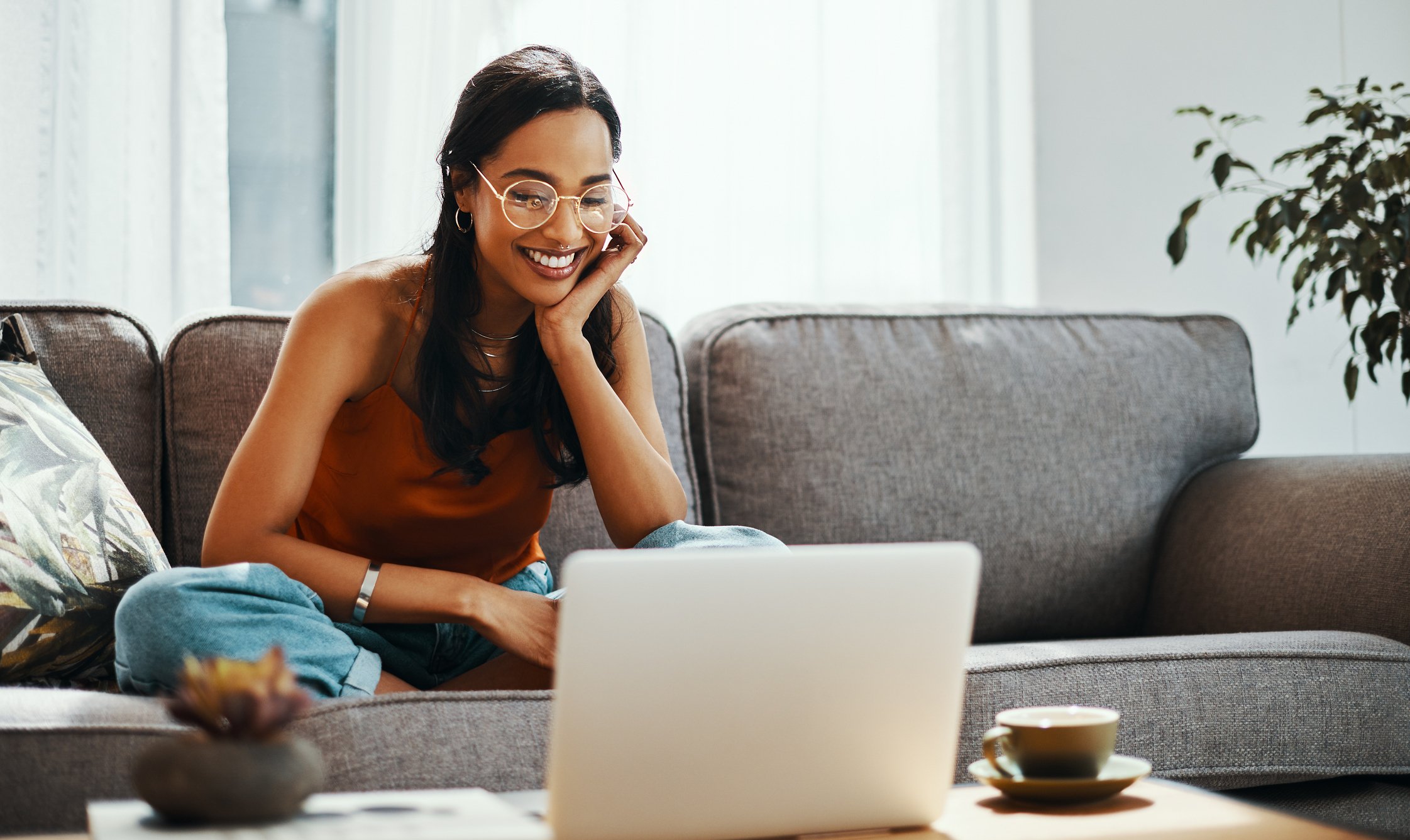 Woman smiling at laptop