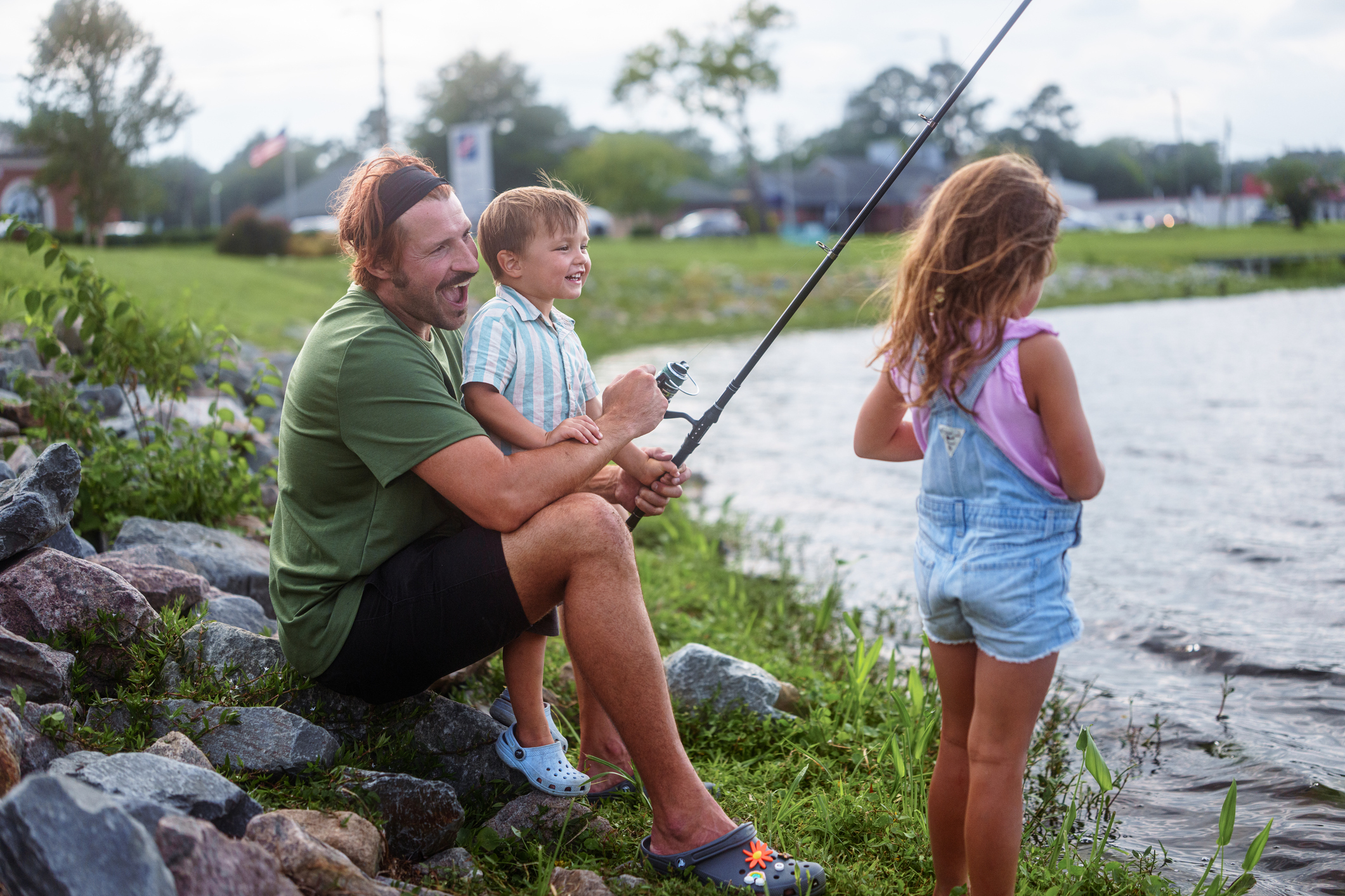 A family smiles while fish